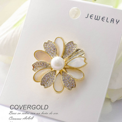 Broches en covergold con baño en Rodio
