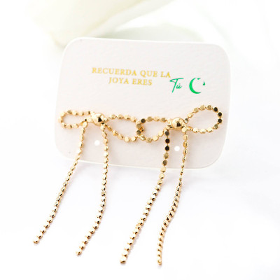 Aretes de moño en covergold con baño en Rodio
